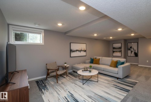 Recessed lighting, window with white trim, gray wall paint, and gray carpeting - 11138 30 Avenue Nw, Edmonton, AB - Indoor
