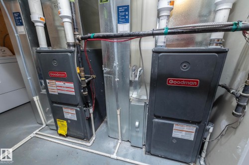 Dual furnace systems with associated ductwork and PVC piping - 11138 30 Avenue Nw, Edmonton, AB - Indoor Photo Showing Basement