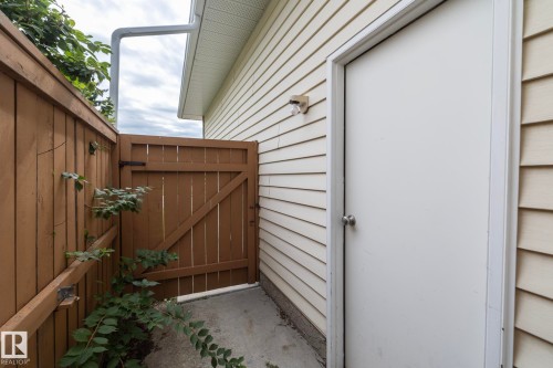 Wood-paneled fencing with a matching gate - 11138 30 Avenue Nw, Edmonton, AB - Outdoor With Exterior