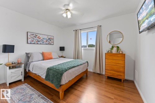Bright interior with wood-finish flooring - 5330 43 Street, Cold Lake, AB - Indoor Photo Showing Bedroom
