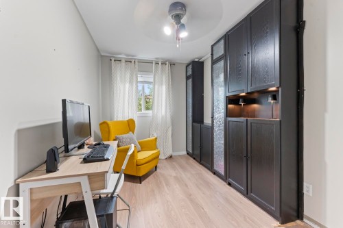 Wood-finish flooring with light wall tones - 5330 43 Street, Cold Lake, AB - Indoor Photo Showing Office