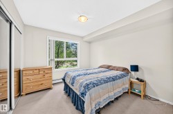 Carpeted flooring, white walls, built-in mirrored closet, and a surface-mounted ceiling light fixture - 