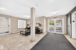 Tiled flooring, double glass entry doors, large window, built-in lighting, and an elevator - 