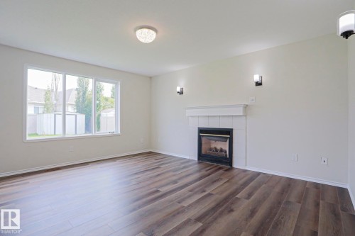 1028 James Crescent Nw, Edmonton, AB - Indoor Photo Showing Living Room With Fireplace