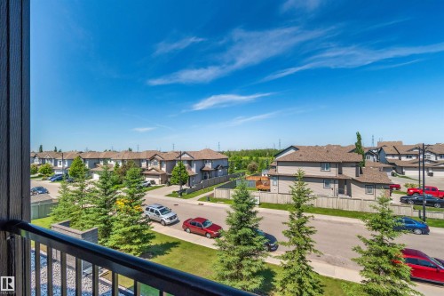 Balcony with metal railing and composite siding - #318 5521 7 Av Sw Sw, Edmonton, AB - Outdoor With View