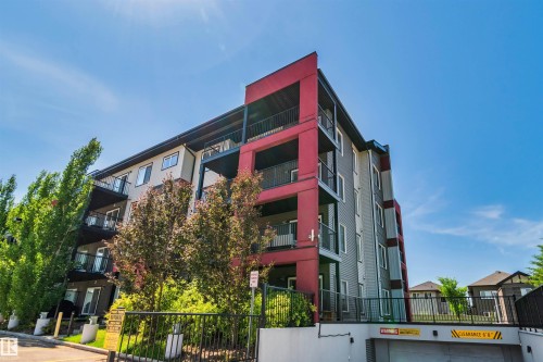 Multi-story building featuring modern red and gray siding - #318 5521 7 Av Sw Sw, Edmonton, AB - Outdoor