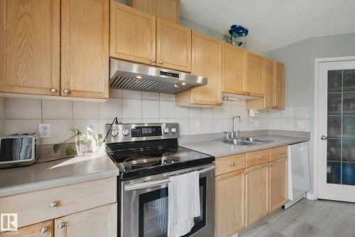 15730 141 Street Nw, Edmonton, AB - Indoor Photo Showing Kitchen With Double Sink