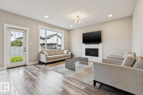 7758 Getty Wynd Nw, Edmonton, AB - Indoor Photo Showing Living Room With Fireplace
