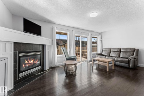 3527 11 Street Nw, Edmonton, AB - Indoor Photo Showing Living Room With Fireplace