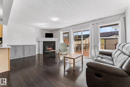 3527 11 Street Nw, Edmonton, AB - Indoor Photo Showing Living Room With Fireplace