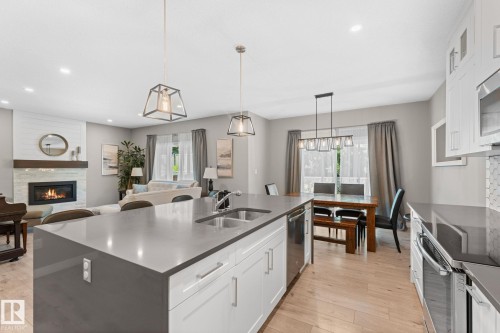 19 Orchard Crest, St. Albert, AB - Indoor Photo Showing Kitchen With Fireplace With Double Sink