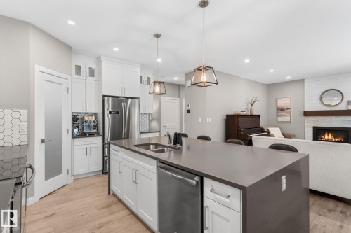 19 Orchard Crest, St. Albert, AB - Indoor Photo Showing Kitchen With Fireplace With Double Sink With Upgraded Kitchen
