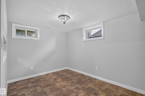 Recessed windows, tile flooring, and a semi-flush mount light fixture - 13214 123 Street Nw, Edmonton, AB 