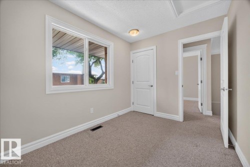 Neutral wall color, wall-to-wall carpeting, and white trim - #47 3812 20 Av Nw, Edmonton, AB 