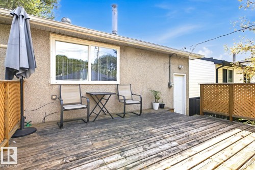 Spacious composite deck featuring wood-finish flooring, ideal for outdoor entertaining - 9740 63 Avenue Nw, Edmonton, AB 