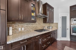 Dark wood-finish cabinetry with silver-tone hardware - 