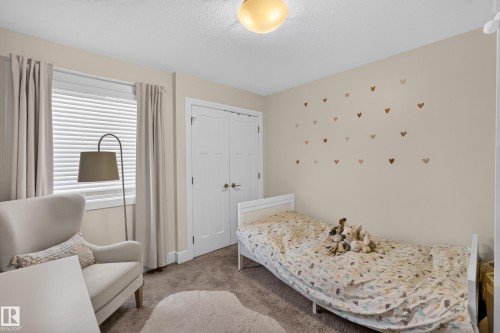 Double-door closet with panel detailing - 3685 Claxton Place Sw, Edmonton, AB 