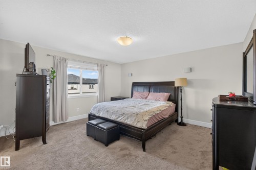 Carpeted flooring, recessed window, and overhead lighting fixture - 3685 Claxton Place Sw, Edmonton, AB 