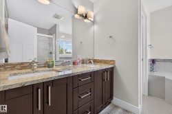 Dual vanity with integrated sinks and a stone countertop - 