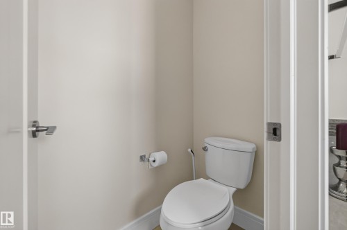 White two-piece toilet - 3685 Claxton Place Sw, Edmonton, AB 