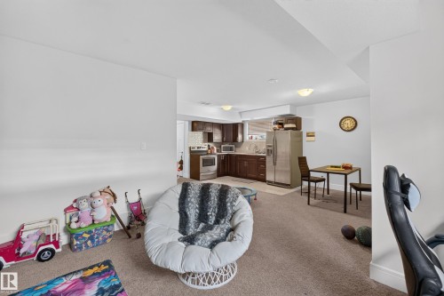 Open-concept living area with carpet flooring - 3685 Claxton Place Sw, Edmonton, AB 