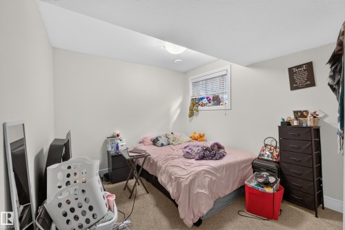 Recessed ceiling lighting, white walls, window with blinds, and neutral carpeting - 3685 Claxton Place Sw, Edmonton, AB 