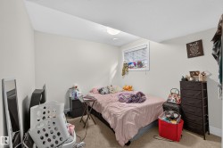 Recessed ceiling lighting, white walls, window with blinds, and neutral carpeting - 