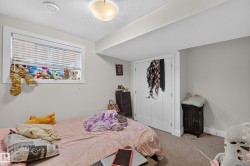 Window with blinds, wall-mounted light fixture, recessed ceiling light, paneled bifold doors, and carpeted flooring - 