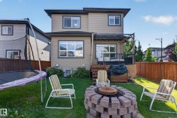Two-story exterior with horizontal siding and multiple windows - 