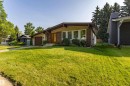 Exterior featuring a brick facade, tan siding, and a prominent front lawn - 16 Brunswick Crescent, St. Albert, AB  - Outdoor 