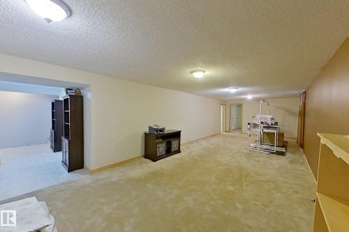 Spacious room featuring carpeting, recessed lighting, and a neutral color palette - 16 Brunswick Crescent, St. Albert, AB - Indoor Photo Showing Other Room
