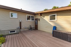 Expansive rear deck featuring wood-finish composite decking - 