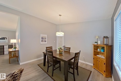 Dining area with wood-finish flooring and light gray walls - 16 Brunswick Crescent, St. Albert, AB - Indoor Photo Showing Dining Room