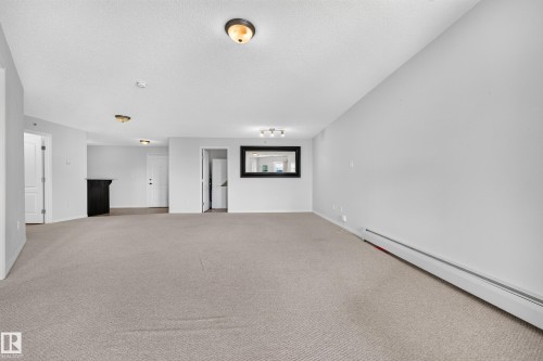 Wall-to-wall carpeting and white walls - #6430 7331 South Terwillegar Dr Nw, Edmonton, AB 