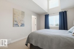 Vaulted ceiling featuring an upper accent window - 