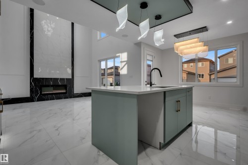 Open-concept living space with a tall ceiling and large format marble-look flooring - 4005 39 Street, Beaumont, AB - Indoor