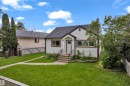 White stucco exterior with a dark shingle roof - 12116 81 Street Nw, Edmonton, AB 