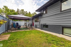 Exterior featuring horizontal siding, a fenced yard, and an outdoor patio space - 