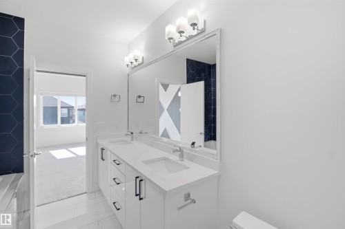 Dual vanity with white cabinetry and quartz countertop - 2027 13 Avenue Nw, Edmonton, AB 
