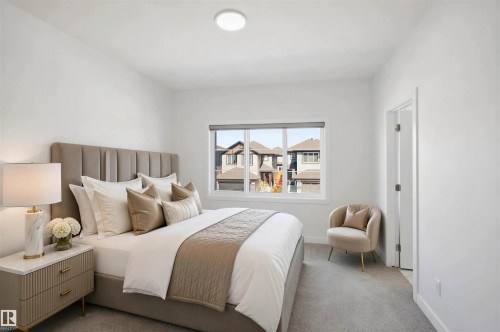 Neutral-toned bedroom with broadloom carpet, flush-mount ceiling light, and a window with roller blind - 2027 13 Avenue Nw, Edmonton, AB 