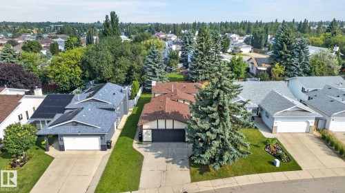 Aerial perspective showcasing a residential property with a brown shingle roof and a two-car garage - 3722 34A Avenue Nw, Edmonton, AB - Outdoor With Facade