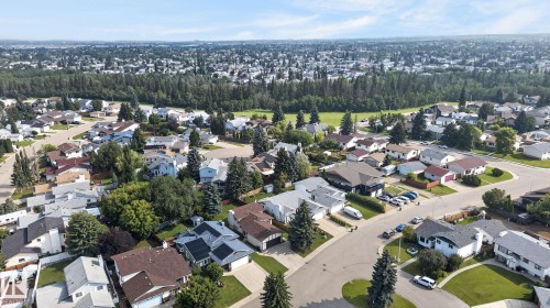 Aerial perspective of a residential neighborhood featuring established homes with mature trees and paved streets - 3722 34A Avenue Nw, Edmonton, AB - Outdoor With View