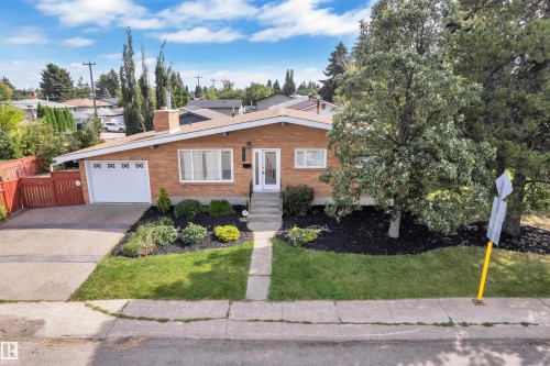 Brick exterior with a prominent chimney - 8803 68A Street Nw, Edmonton, AB 