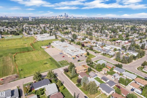 Expansive urban landscape featuring a dense residential area, broad streets, and a discernible city skyline - 8803 68A Street Nw, Edmonton, AB 