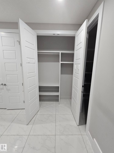 Rear Foyer, Built-in closet organizers throughout - Edmonton, AB 