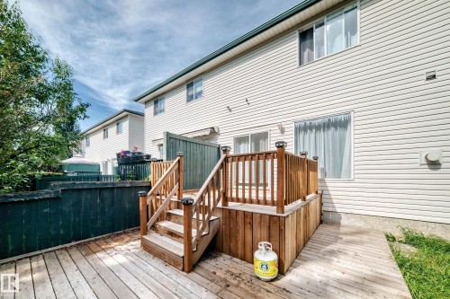 Expansive rear wooden deck featuring a multi-level design and a wooden staircase - #30 300 Hooper Cr Nw, Edmonton, AB 