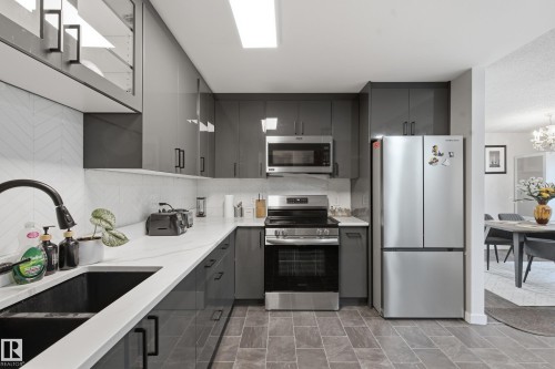 5303 21 Avenue Nw, Edmonton, AB - Indoor Photo Showing Kitchen With Stainless Steel Kitchen With Double Sink With Upgraded Kitchen