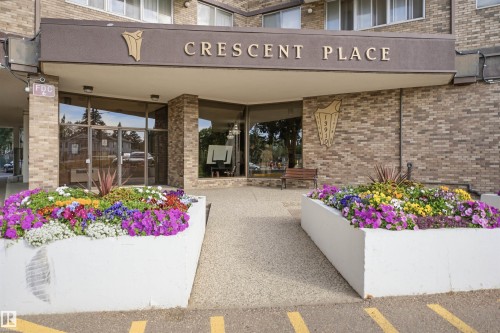 Brick exterior with a prominent entry awning - #1115 13910 Stony Plain Rd Nw, Edmonton, AB 