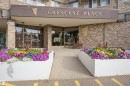 Brick exterior with a prominent entry awning - #1115 13910 Stony Plain Rd Nw, Edmonton, AB 