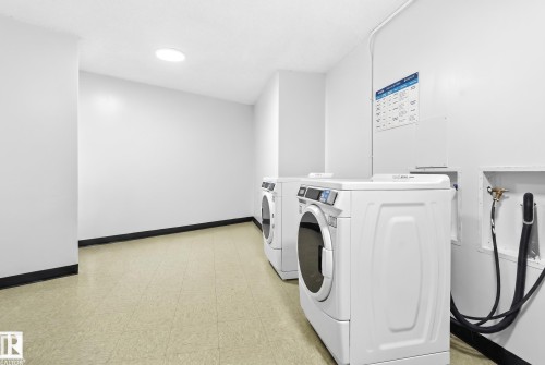 Laundry area with two front-loading machines and tile flooring - #1115 13910 Stony Plain Rd Nw, Edmonton, AB 